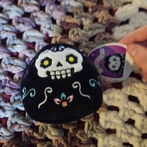Squishmallows Black Skull Plush with Colorful Accents